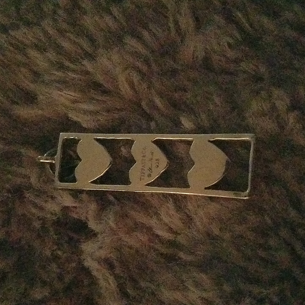 Tiffany an Co  Three heart pendant.